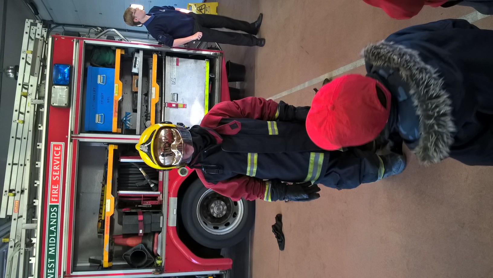 Boy Dressed in Fireman's kit